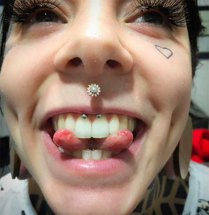 Which would you rock--a bunch of piercings or tattoos?